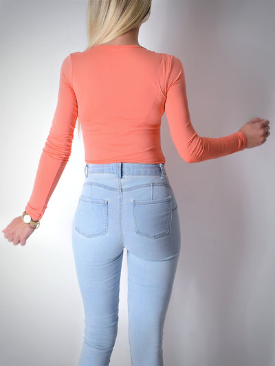 Orange long sleeve bodysuit